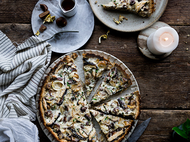 A whole Vegan Chestnut and Mushroom Tart served in a tart pan