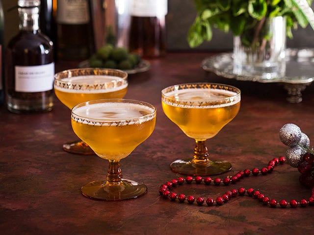 Cacao Champagne Cocktails in champagne glasses -cocktail recipes - goodhomesmagazine.com
