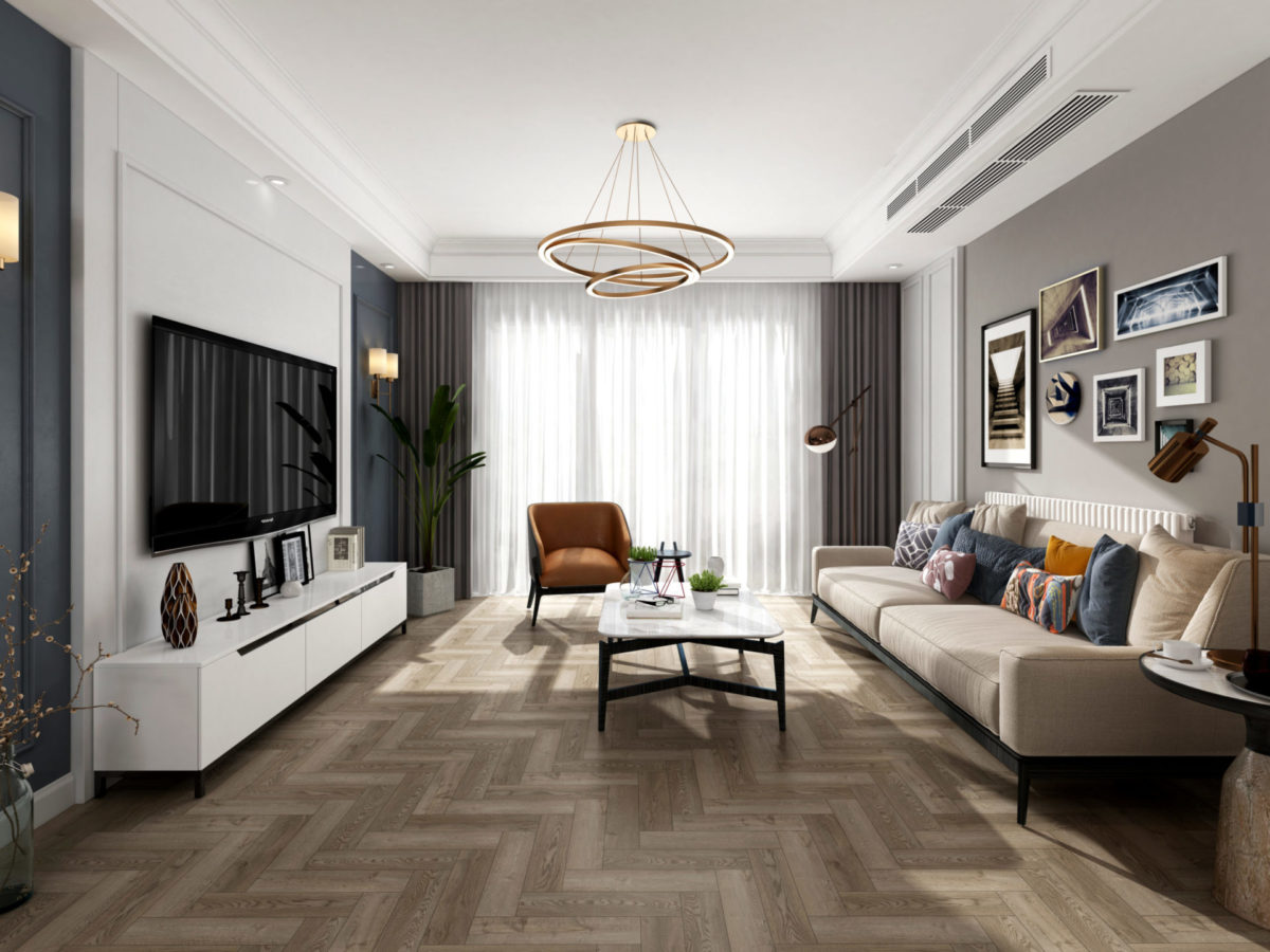 living room with sofa facing wall-mounted television, table, chair and herringbone floor
