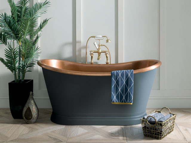 freestanding copper roll top tub with custom blue paint job