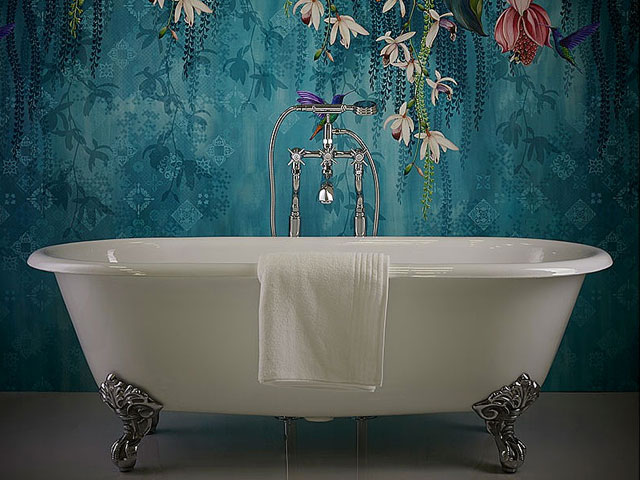 claw-foot bathtub from CP Hart with floral print bathroom wallpaper