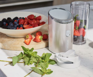 Cordless blender kitchen gadgets with strawberries, mint and blackberries