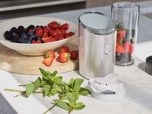 Cordless blender kitchen gadgets with strawberries, mint and blackberries