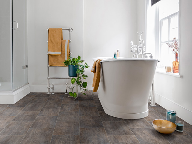 modern bathroom with wood effect vinyl floor - cosy bathrooms - goodhomesmagazine.com