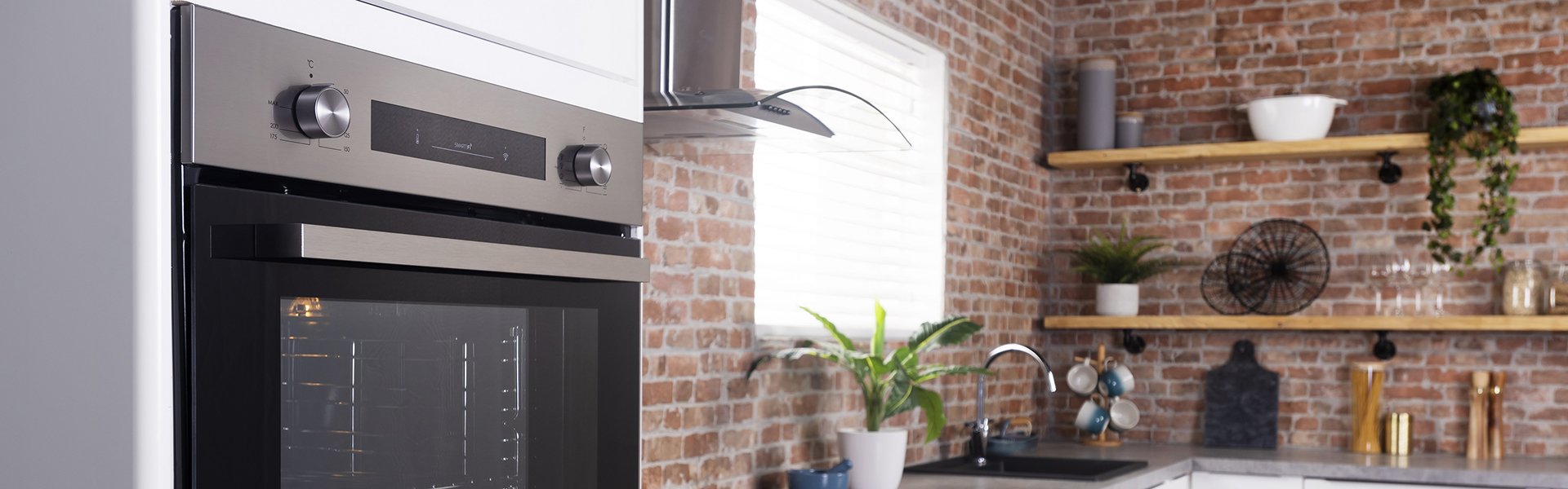 E Black Built-in Electric Single Oven in brickwork kitchen