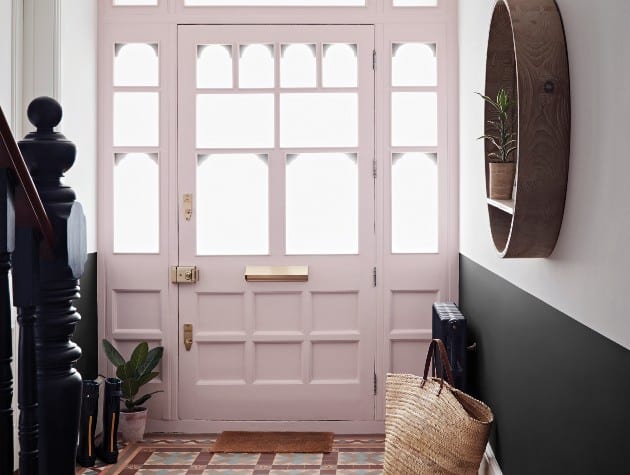 hallway with tiled floor and traditional wooden door