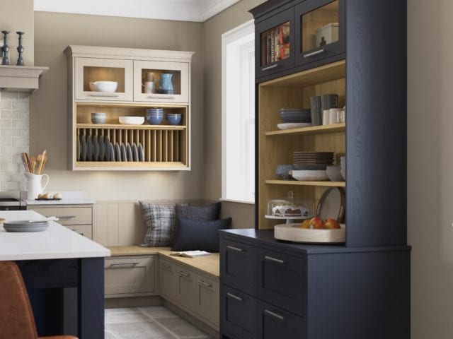 kitchen with blue dresser, seating corner and stone tile floor