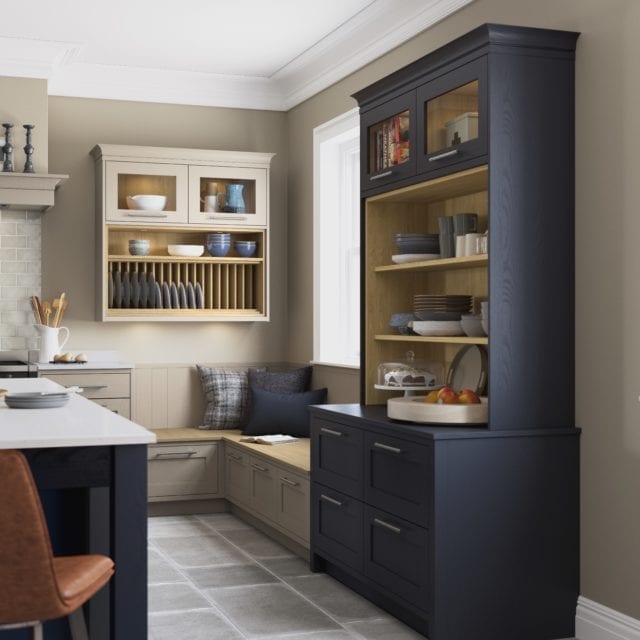 kitchen with blue dresser, seating corner and stone tile floor