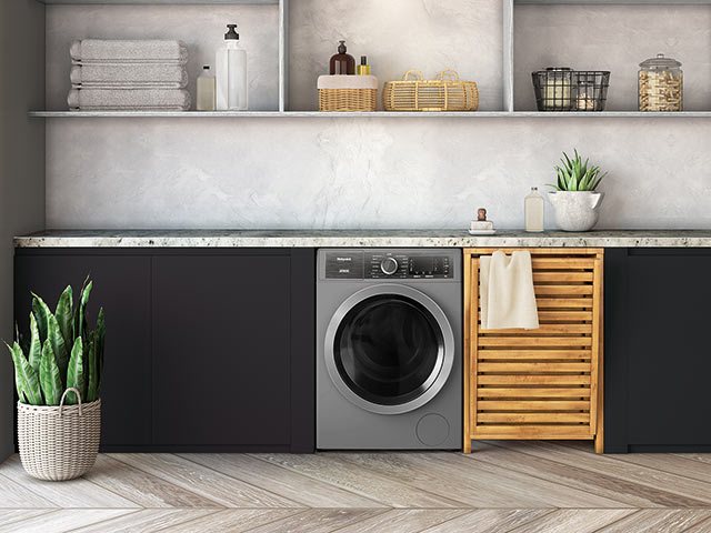 Grey washing machine in utility room