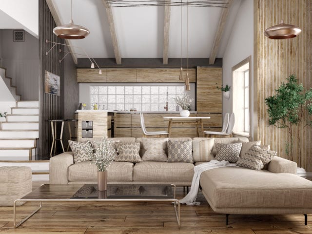 coffee table and l-shaped sofa with modern kitchen behind