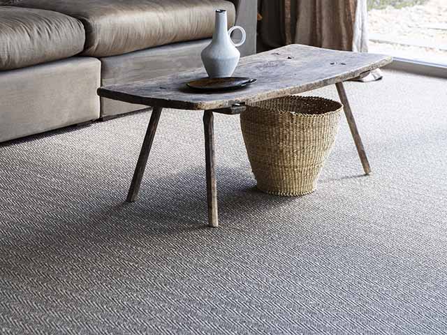 Sisal fibre natural carpet in lounge with coffee table and settee, goodhomesmagazine.com