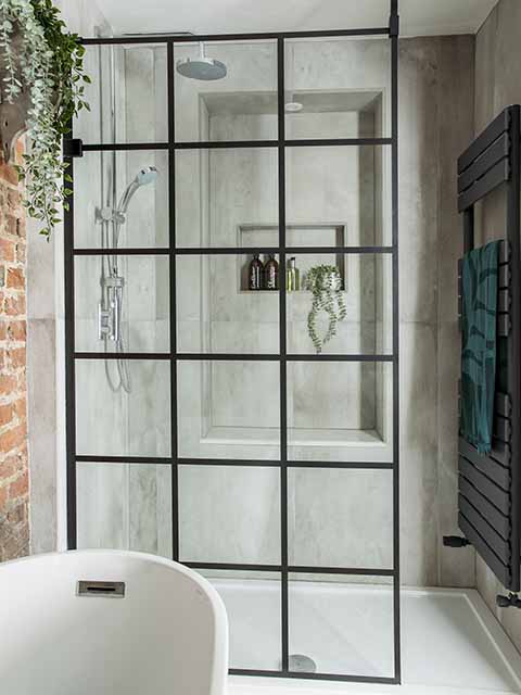 Walk in shower screen with exposed brickwork to side, goodhomesmagazine.com