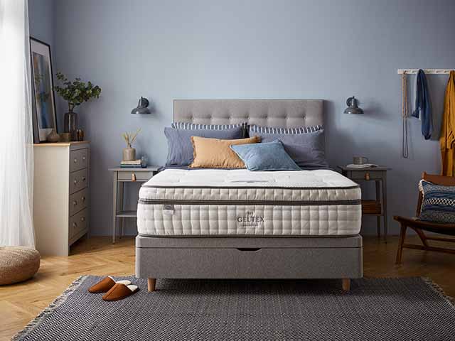 Silent Night buttoned headboard with geltex mattress, styled with bright cushions, goodhomesmagazine.com