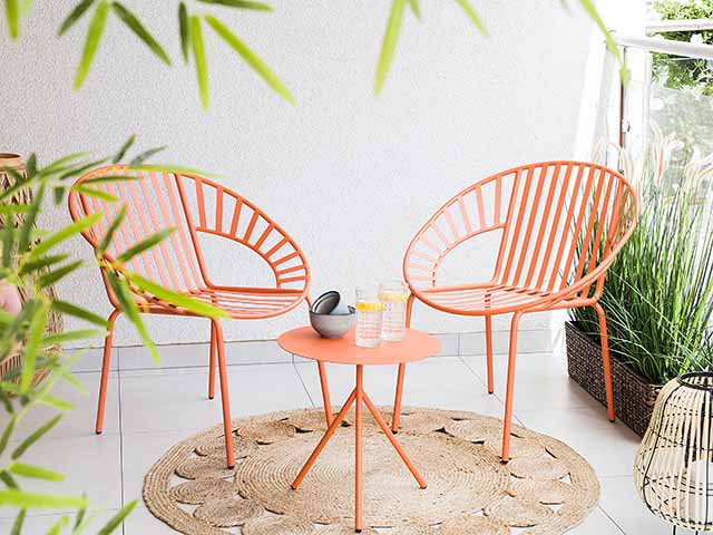 Bright orange quirky garden furniture on patio, goodhomesmagazine.com