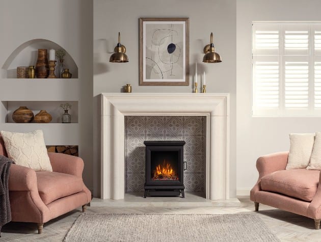 living room with matching pink armchairs, rug and stove in fireplace