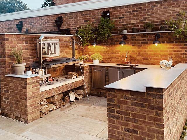 Outdoor brickwork kitchen with outdoor lighting, goodhomesmagazine.com