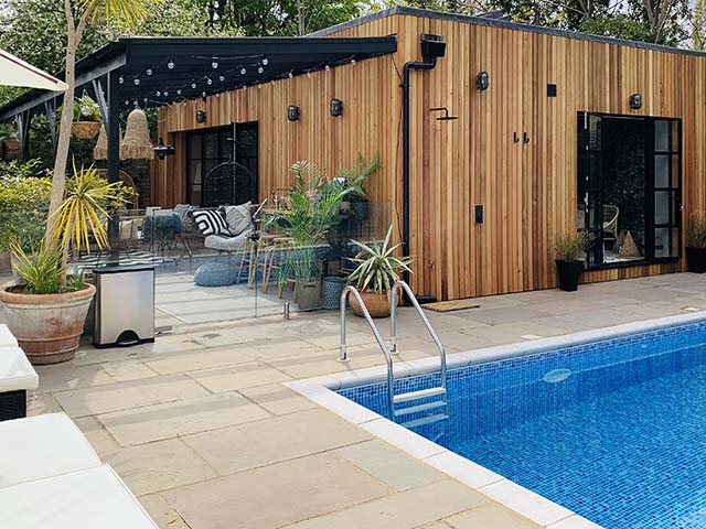 zoned space with outdoor pool and outside lighting, goodhomesmagazine.com