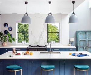 kitchen island with three blue chairs, pendant lighting and breakfast