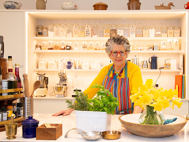 Prue Leith's kitchen is colourful and functional with lots of shelves and clearly labeled jars 