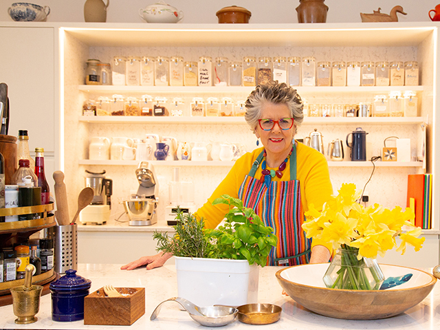 Prue Leith's kitchen is colourful and functional with lots of shelves and clearly labeled jars