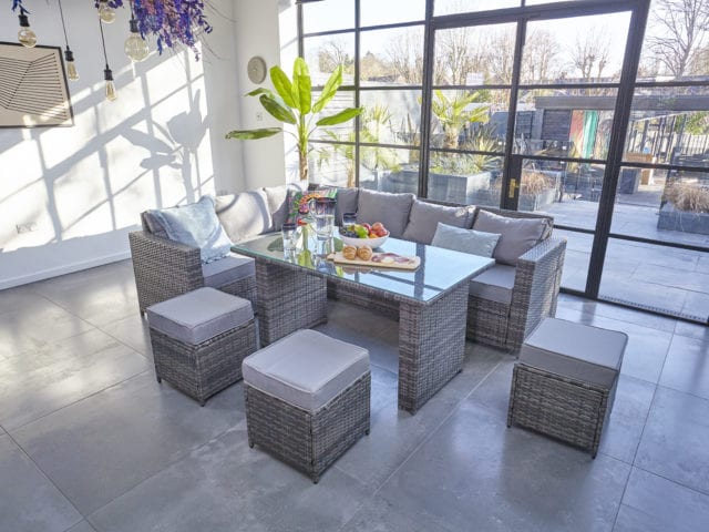 Modern room with steel frame windows and Furniture Maxi Barcelona rattan furniture dining set in grey