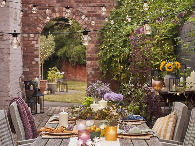 Garland fairy lights in courtyard setting garden revamp