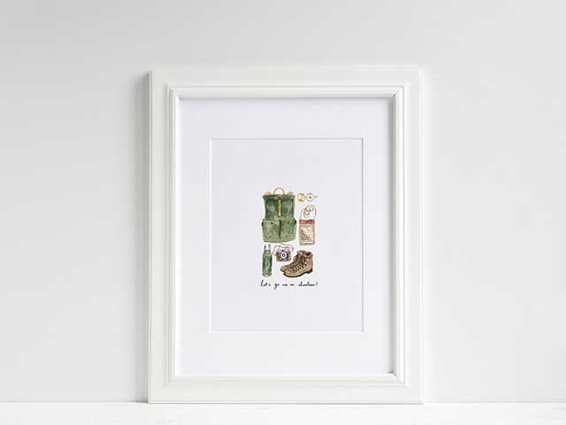 Illustrated print in a white frame showing adventure equipment - Father's Day - Goodhomesmagazine.com