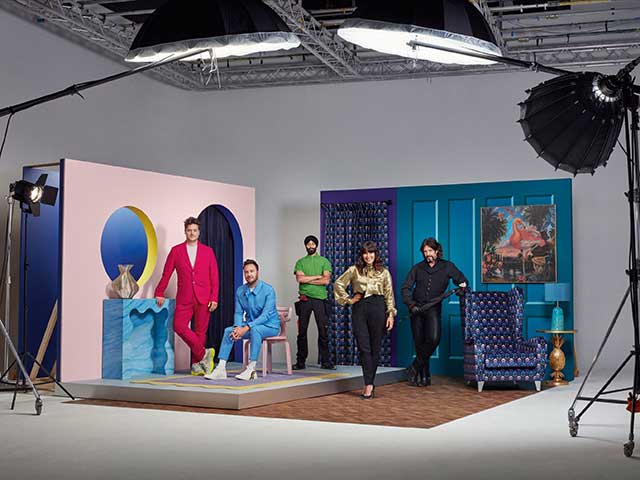 Changing Rooms team in the studio wearing bright colours