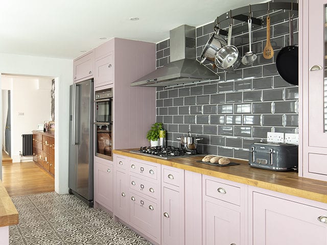 kitchen makeover with pink painted cabinets and grey wall tiles