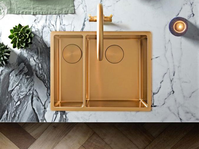 copper kitchen sink with white marble worktop