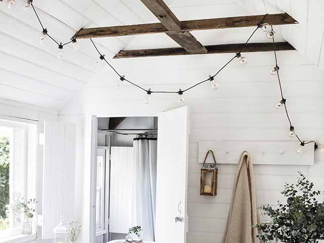 Fairy lights hanging in summer bedroom, goodhomesmagazine.com