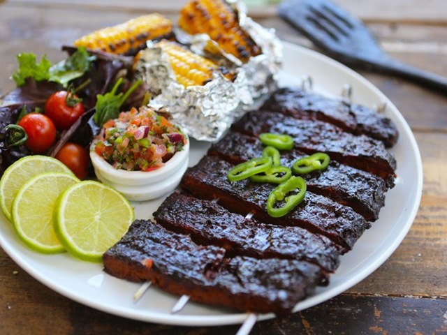Sticky ribs on a plate with a side salad - Barbecue recipes - Goodhomesmagazine.com