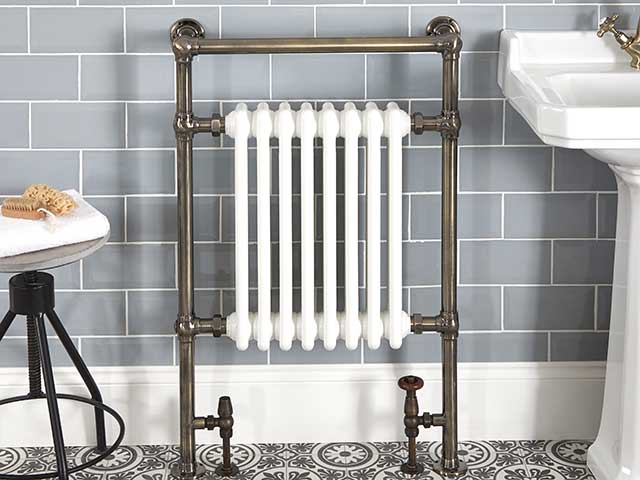 white marble heated towel rail with chrome pipes
