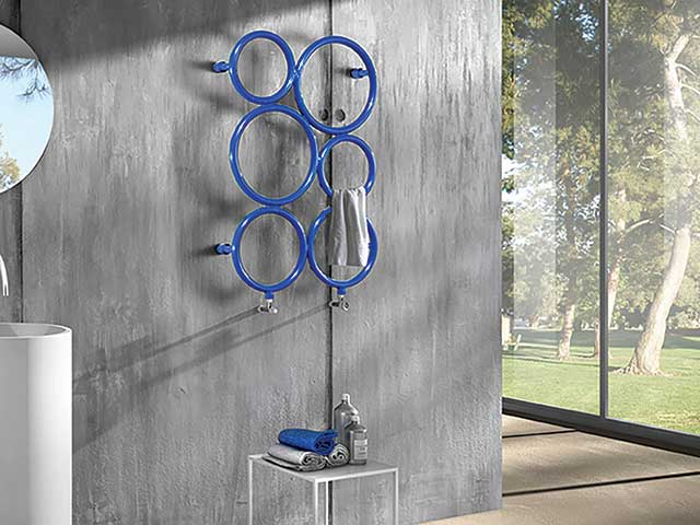 blue bubble heated towel rail mounted on wall