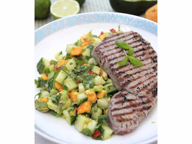 Tuna steak on a plate with a mango salsa salad - Barbecue recipes - Goodhomesmagazine.com