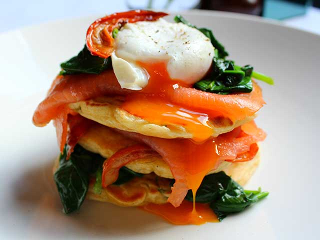 Sweetcorn fritters topped with salmon, poached eggs, and spinach - Father's Day breakfasts - Goodhomesmagazine.com