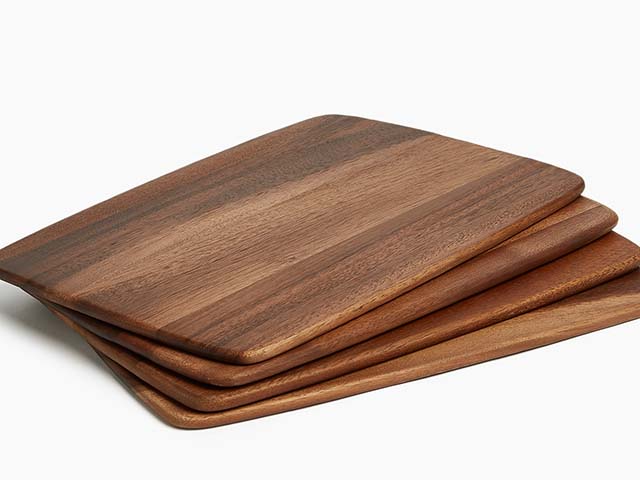 Acacia wood placemats on white background, goodhomesmagazine.com