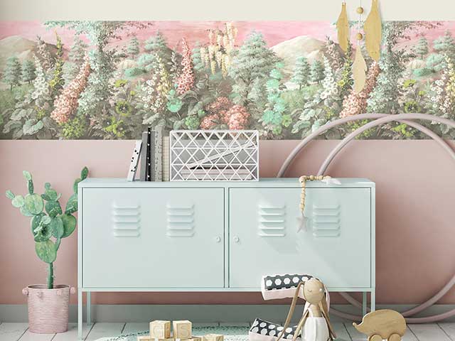 Colourful pastel border on a pink wall behind a blue locker and lots of children's toys - Goodhomesmagazine.com