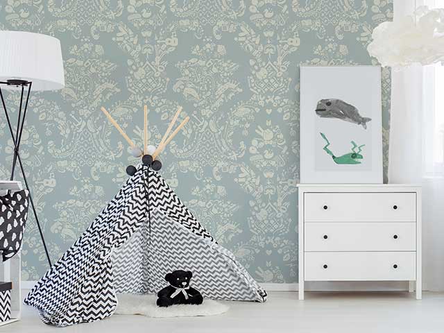 A child's bedroom with a light blue floral damask wallpaper on the walls behind a teepee - Instagram wallpaper trends - Goodhomesmagazine.com
