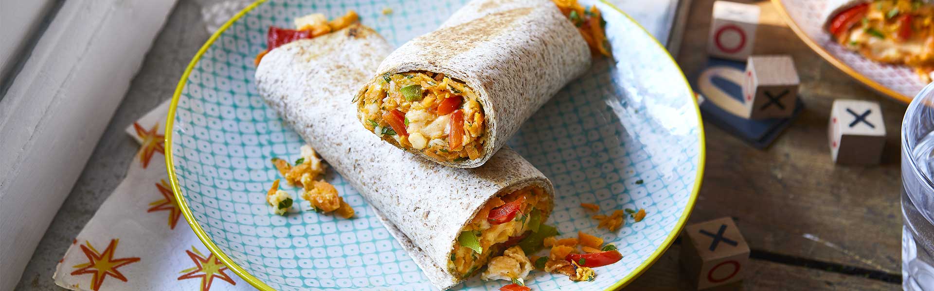 Two burrito wraps on a checked blue plate - Father's Day breakfasts - Goodhomesmagazine.com