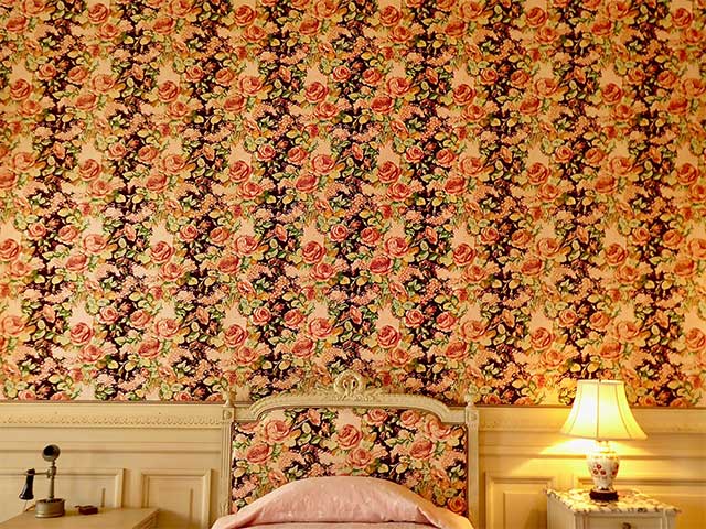Vintage-style floral wallpaper in an orange and pink colour scheme - Statement bedroom - Goodhomesmagazine.com