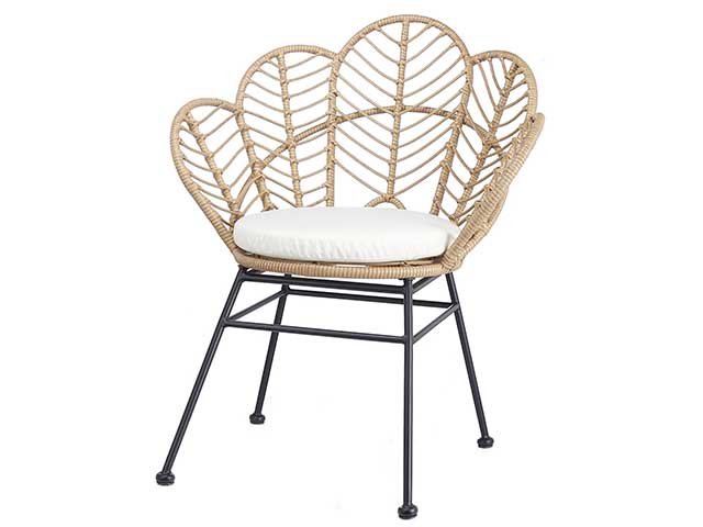 Rattan chair with black steel legs and a white seat cushion - Rattan - Goodhomesmagazine.com
