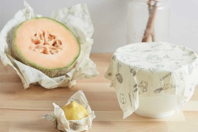 PLASTIC FRFEE JULY ideas for the kitchen: beeswax food wrap around a bowl and another around some fruit 
