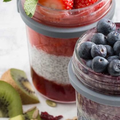 Glass jars filled with layers of yoghurt, compote, and fruit - Summer kitchen essentials - Goodhomesmagazine.com