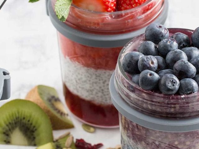 Glass jars filled with layers of yoghurt, compote, and fruit - Summer kitchen essentials - Goodhomesmagazine.com