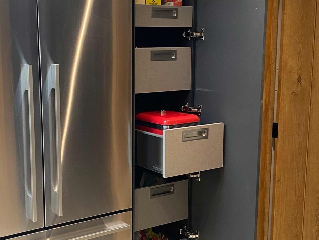 interior of modern larder unit showing pull-out tower storage