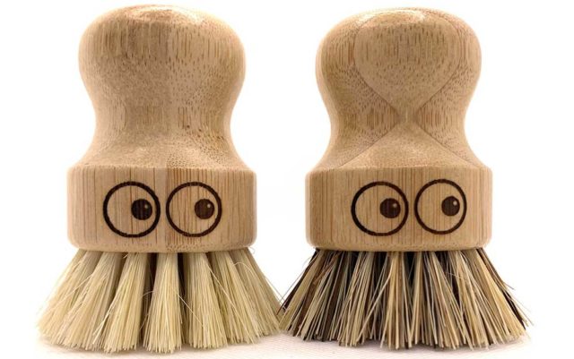 Two bamboo scrubbing brushes each featuring hand-drawn eyes - Sustainable kitchen swaps - Goodhomesmagazine.com