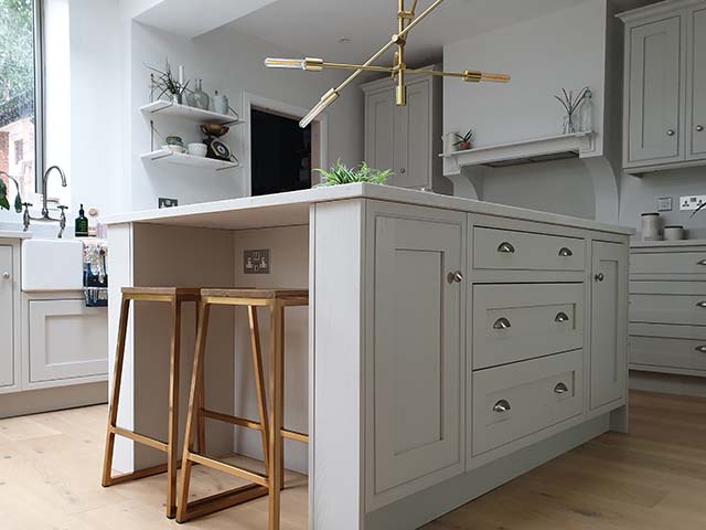 kitchen island with wooden bar stools and neutral units, Good Homes magazine