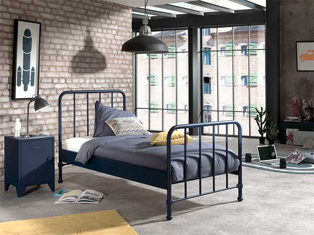 Small metal storage locker bedside table in navy next to a matching single bed frame - Metal storage lockers - Goodhomesmagazine.com