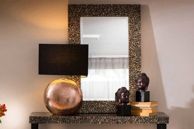 Mosaic mirror on a table top with the same pattern - Tile decor trends - Goodhomesmagazine.com